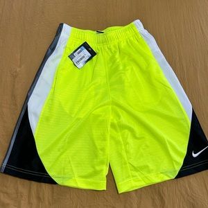 Boys medium fluorescent yellow Nike shorts.